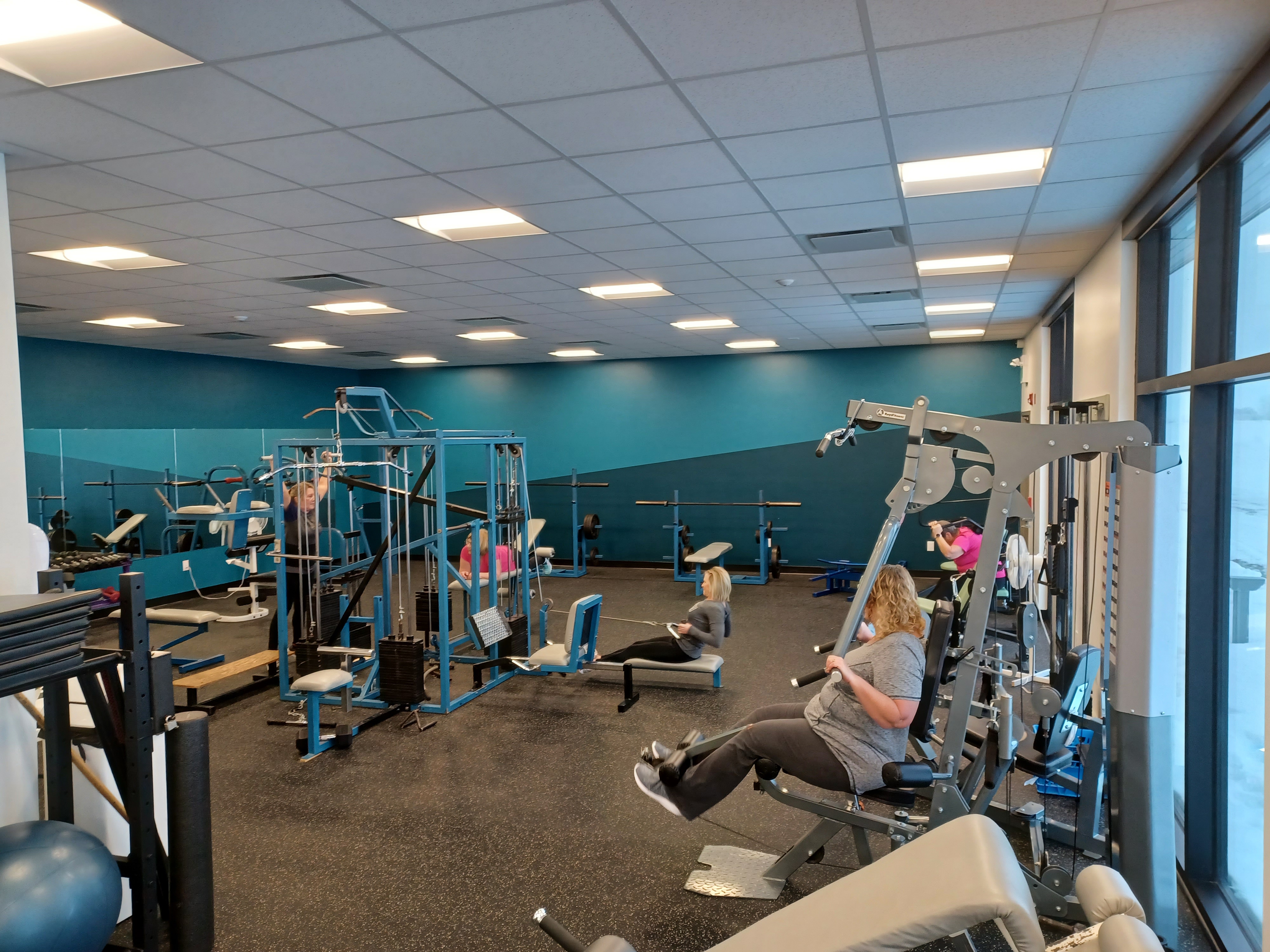 SCHIKOWSKI FAMILY FARMS FITNESS CENTRE MEMBERS WORKINGOUT IN ELBOW, SK 1